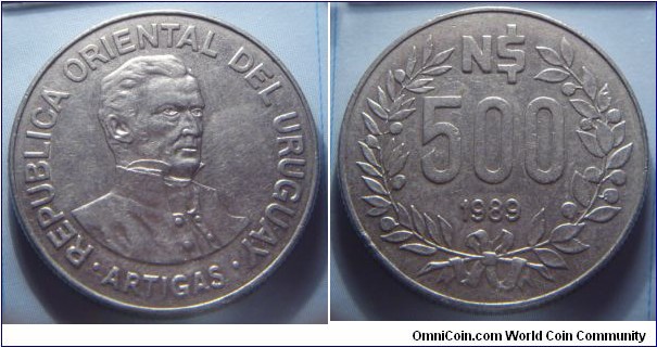 Uruguay | 
500 Nuevos Pesos, 1989 | 
29 mm, 11.78 gr. | 
Stainless Steel | 

Obverse: Jodé Artigas facing right | 
Lettering: • REPUBLICA ORIENTAL DEL URUGUAY • ARTIGAS | 

Reverse: Denomination within Laurel wreath, date below | 
Lettering: N$ 500 1989 |