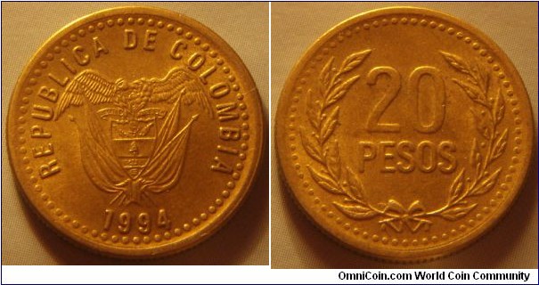 Colombia |
20 Pesos, 1994 | 
20.25 mm, 3.6 gr. | 
Aluminium-bronze | 

Obverse: National Coat of Arms, date below | 
Lettering: REPUBLICA DE COLOMBIA 1994 |

Reverse: Denomination within wreath |
Lettering: 20 PESOS |
