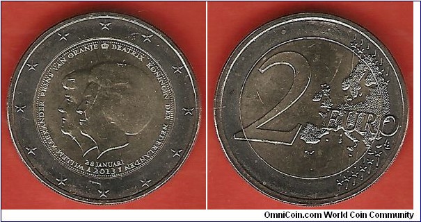 2 euro coin commemorating the abdication of queen Beatrix. Both queen Beatrix and crown prince Willem-Alexander are depicted