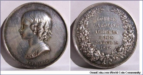 1850 UK Royal Family Children LOUISE CAROLINE ALBERTA Medal by L.C. Wyon. Silver: 32MM.
Obv: Portrait of Young Louise Caroline Alberta to left sihned L.C.W. SEPT: 1850. Rev: Wreath surround with legend LOUISE CAROLINE ALBERTA BORN MARCH 18, 1848
