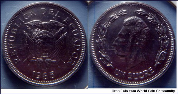 Ecuador | 
1 Sucre, 1986 | 
26 mm, 6.6 gr. | 
Nickel clad Steel | 

Obverse: National Coat of Arms, date below | 
Lettering: REPUBLICA DEL ECUADOR 1986 | 

Reverse: Antonio José de Sucre facing left within laurel wreath, denomination below | 
Lettering: UN SUCRE |