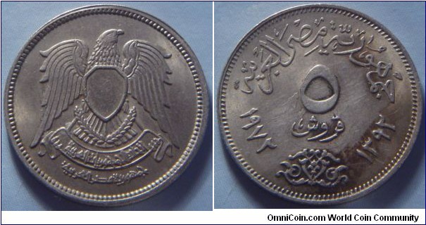 Egypt | 
5 Piastres, 1972 (1392) | 
25 mm, 4.5 gr. | 
Copper-nickel | 

Obverse: National Coat of Arms | 

Reverse: Denomination, Gregorian date left, Arabic date right | 
Lettering: الجمهورية العربية المتحدة ٥ قروش ١٩٧٢ ١٣٩٢ |