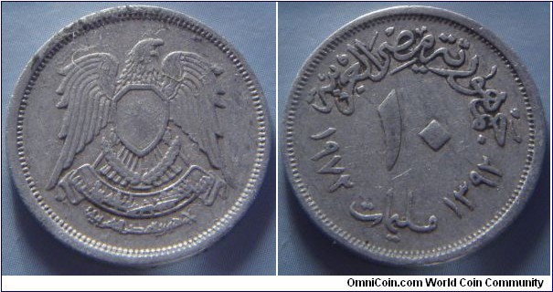 Egypt | 	
10 Piastres, 1972 (1392) | 
27 mm, 5.9 gr. | 
Copper-nickel | 

Obverse: National Coat of Arms | 

Reverse: Denomination, Gregorian date left, Arabic date right | 
Lettering: الجمهورية العربية المتحدة ١٠ قروش ١٩٧٢ ١٣٩٢ |