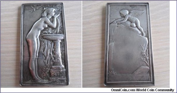 1898 o j France Art Nouveau LA SOURCE Plaque by Jean-Baptiste Daniel-Dupuis. Silver 37X67MM
Obv: Depict a nude girl drinking water at ornate fountain, in the field. DD monogram, signed below DANIEL DUPUIS. Rev: A Cherub on  rock peering over waterfall, below signed DANIEL DUPUIS.