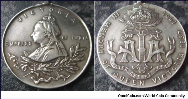 1901 British Victoria Empress of India ATA Royal Army Temperance Medal. Silver 35MM.
Obv: Bust of Victoria crowned & veiled to left, wreath & ribbon below. Legend VICTORIA EMPRESS OF INDIA. Rev: Symbol ATA with Crown on top, banner WATCH AND BE SOBER. Legend IN MEMORY OF QUEEN VICTORIA 1837  1901.
