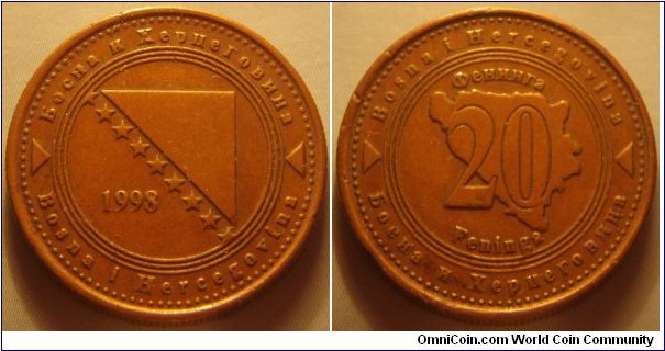 Bosnia and Herzegovina | 
20 Feninga, 1998 | 
22 mm, 4.5 gr. | 
Copper plated Steel | 

Obverse: National Coat of Arms, date left | 
Lettering: Босна и Херцговина Bosna i Hercegovina 1998 | 

Reverse: Denomination on Map of Bosnia | 
Lettering: Feninga Bosna i Hercegovina Фенинга 20 Feninga Босна и Херцговина |