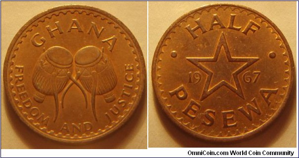 Ghana | 
½ Pesewa, 1967 | 
20.2 mm, 2.9 gr. | 
Bronze | 

Obverse: Ewe Drums | 
Lettering: GHANA FREEDOM AND JUSTICE | 

Reverse: Star outline in centre dividing date and denomination | 
Lettering: • HALF • PESEWA 1967 |