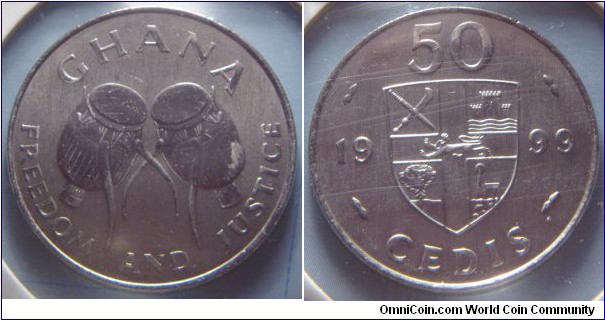 Ghana | 
50 Cedis, 1999 | 
27.5 mm, 7.5 gr. | 
Nickel plated Steel | 

Obverse: Ewe Drums | 
Lettering: GHANA FREEDOM AND JUSTICE | 

Reverse: Shield divide date and denomination | 
Lettering: 50 CEDIS 1999 |