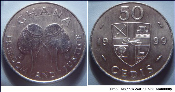 Ghana | 
50 Cedis, 1999 | 
27.5 mm, 7.5 gr. | 
Nickel plated Steel | 

Obverse: Ewe Drums | 
Lettering: GHANA FREEDOM AND JUSTICE | 

Reverse: Shield divide date and denomination | 
Lettering: 50 CEDIS 1999 |