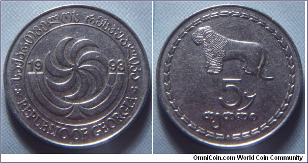 Georgia | 
5 Tetri, 1993 | 
20 mm, 2.5 gr. | 
Stainless Steel | 

Obverse: Borjgali, a Georgian symbol of the Sun with seven rotating wings, over the Christian Tree of Life divide date | 
Lettering: საქართველოს რესპუბლიკა REPUBLIC OF GEORGIA 1993| 

Reverse: Stylized lion, denomination below | 
Lettering: 5 თეთრი |