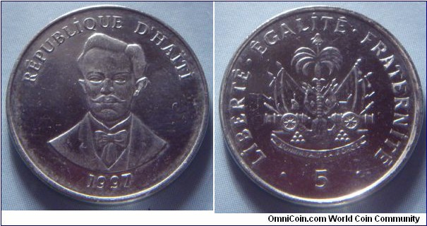 Haiti | 
5 Centimes, 1997 | 
19.9 mm, 3.1 gr. | 
Nickel plated Steel | 

Obverse: Charlemagne Masséna Péralte, date below | 
Lettering: RÉPUBLİQUE D’HAÏTİ 1997 | 

Reverse: National Coat of Arms, denomination below | 
Lettering: • LİBERTÉ•ÉGALİTÉ•FRATERNİTÉ • 5 |