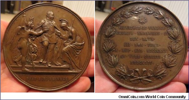 1871 Italia Vittorio Emanuelle II King of Rome Annexation Medal by C. Moscetti. Bronze: 76MM
Obv: King Vittorio Emanuette II with wined Genius raised helmeted Minerva, Rome resurgent after centuries. Rev: Laurel, Stars of Italian Destiny over 7-line Latin inscription on law annexing Rome to newly unified Italy.
