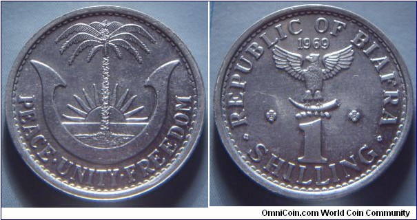 Biafra | 
1 Shilling, 1969 | 
23.5 mm, 1.6 gr. | 
Aluminium | 

Obverse: Palm tree with rising sun | 
Lettering: PEACE•UNITY•FREEDOM | 

Reverse: Eagle with horn, date above, denomination below | 
Lettering: REPUBLIC OF BIAFRA 1969 1 SHILLING |