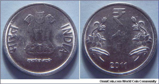 India | 
1 Rupee, 2011 | 
22 mm, 3.8 gr. | 
Stainless Steel | 

Obverse: Ashoka Lion Capitol | 
Lettering: भारत INDIA रूपये सत्यमेव जयते | 

Reverse: Denomination, date below| 
Lettering: ₹ 1 2011 |