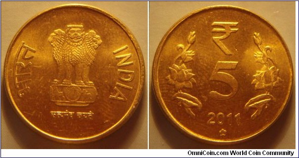India | 
5 Rupees, 2011 | 
23 mm, 6 gr. | 
Nickel-brass | 

Obverse: Ashoka Lion Capitol, date below | 
Lettering: भारत INDIA रूपये सत्यमेव जयते 2010 | 

Reverse: Denomination, date below | 
Lettering: ₹ 5 2011 |