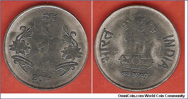 1 rupee in stainless steel. Calcutta mint. Weak strike (not uncommon in India)
