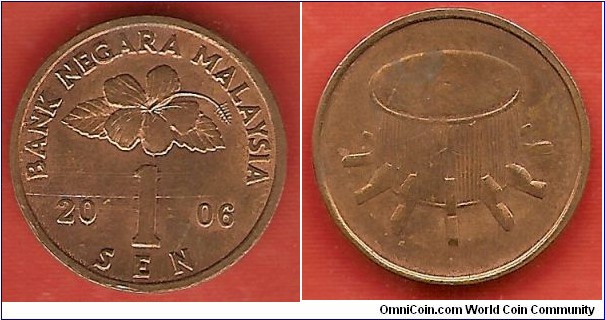 1 sen, struck in bronze plated steel. The reverse shows a drum.