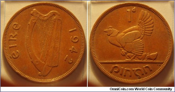 Ireland | 
1 Pingin, 1942 | 
30.9 mm, 9.45 gr. | 
Bronze | 

Obverse: Irish harp (Cláirseach), date right|
Lettering: éire 1942 | 

Reverse: Hen with chicks facing left, denomination above | 
Lettering: 1d pingin |
