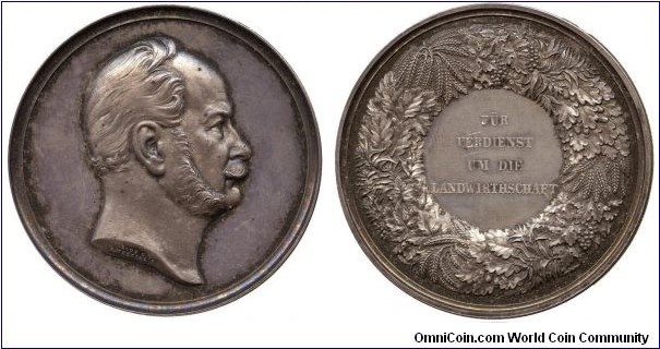 1900 o.j. German Prussia Wilhelm I (1797-1861-1888) Agricultural Award Medal by A Mertens for Loos. Silver 50.5MM./56.98 gms.
Obv: Bust of Pressia Wilhelm I to left.Sihned LOOS D A. MERTENS. Rev: Wreath in various plants surround with legend FUR VERDIENST UM DIE LANDWIRTHSCHAFT in centre.
