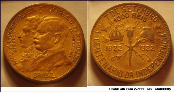 Brazil | 
1,000 Réis, ND (1922) – Independence Centennial | 
26 mm, 7.8 gr. | 
Aluminium-bronze | 

Obverse: Dom Pedro I of Brazil and Epitácio Lindolfo da Silva Pessoa facing left | 
Lettering: ACCLAM. DA INDEPENDENCIA X.PRESID. DA REPUBLICA D.PEDRO I. EPITACIO PESSOA BRASIL | 

Reverse: Torch separate dates, denomination above | 
Lettering: 7 DE SETEMBRO 1º CENTENARIO DA INDEPENDENCIA 1822 1922 1000 RÉIS |