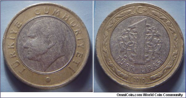 Turkey | 
1 Lira, 2010 | 
26.15 mm, 8.2 gr. | 
Bi-metallic: Nickel-bronze centre in Brass ring | 

Obverse: Mustafa Kemal Atatürk facing left within circle | 
Lettering: TÜRKİYE CUMHURİYETİ • | 

Reverse: Denomination centre, crescent moon and star above, date below | 
Lettering: 1 TÜRK LİRASI 2010 |