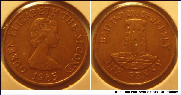 Jersey | 
1 Penny, 1985 | 
20.32 mm, 3.55 gr. | 
Bronze | 

Obverse: Queen Elizabeth II facing right, date below | 
Lettering: QUEEN ELIZABETH THE SECOND 1985 | 

Reverse: Le Hocq Tower, denomination below | 
Lettering: BAILIWICK OF JERSEY ONE PENNY |