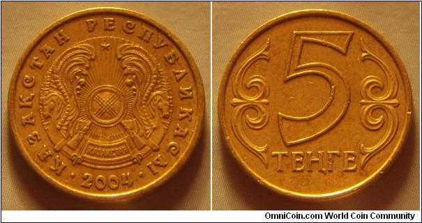 Kazakhstan | 
5 Teñge, 2004 | 
17.27 mm, 2.18 gr. | 
Nickel-brass | 

Obverse: National Coat of Arms, date below | 
Lettering: • ҚАЗАҚСТАН РЕСПУБЛИКАСЫ • 2004 | 

Reverse: Denomination | 
Lettering: 5 ТЕҢГЕ |