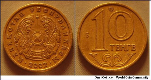 Kazakhstan | 
10 Teñge, 2002 | 
19.56 mm, 2.81 gr. | 
Nickel-brass | 

Obverse: National Coat of Arms, date below | 
Lettering: • ҚАЗАҚСТАН РЕСПУБЛИКАСЫ • 2002 | 

Reverse: Denomination | 
Lettering: ҚҰБ 10 ТЕҢГЕ |