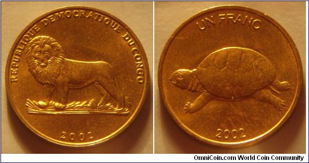 Democratic Republic of the Congo | 
1 Franc, 2002 | 
21.95 mm, 4.57 gr. | 
Brass | 

Obverse: Lion, date below | 
Lettering: REPUBLIQUE DEMOCRATIQUE DU CONGO 2002 | 

Reverse:  Turtle, denomination above, date below | 
Lettering: UN FRANC 2002 |