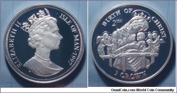Isle of Man | 
1 Crown, 1997 – Birth of Christ | 
38.61 mm, 28.5 gr. | 
Copper-nickel | 

Obverse: Queen Elizabeth II facing right, date right | 
Lettering: ELIZABETH II ISLE OF MAN•1997 | 

Reverse: Madonna with baby Jesus and angels, denomination below | 
Lettering: BIRTH OF CHRIST 2|0°0’0” 1 CROWN |