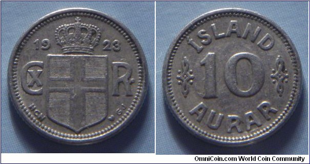 Iceland | 
10 Aurar, 1923 | 
14.7 mm, 1.48 gr. | 
Copper-nickel | 

Obverse: Crowned Coat of arms divides monogram date | 
Lettering: 1923 CX R• |

Reverse: Denomination | 
Lettering: ÍSLAND 10 AURAR |