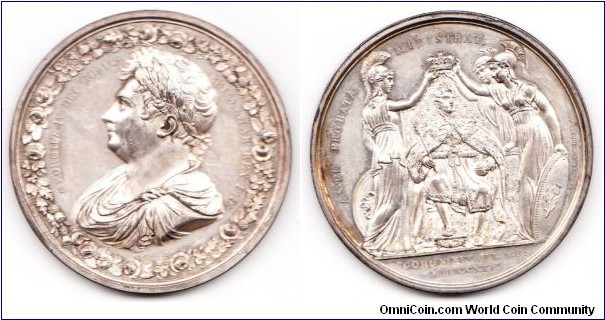 1821 UK George IV Coronation strunk by Thomason & Jones Medal. Silver: 53MM./73.7 gms.
Obv: Bust of George IV with wreath of Roses, Shamrocks & Thistles. Legend GEORGIUS IV DEI GRATIA BRITANNIAR REX F:D:. Rev: The king enthorned, crowned by Britians, Hibernia & Scotia, representing Britian, Ireland & Scotland. Legend ANTE PROBATA MINISTRAT CORON: XIX JUL: A.D. MDCCCXI, THOMPSON & JONES JULY 19, 1821.
