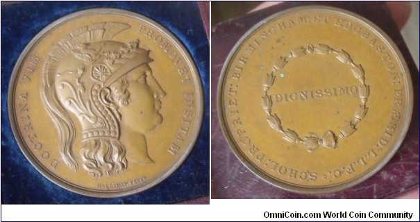 1800 o j UK Birmingham & Edgbaston Academic School Prize Medal by Halliday Fecit. Bronze: 57MM.
Obv: Bust of Minerva right, wearing ornate plumped helmet. Legend DOCTRINA VIM PROMOVET INSITAM. Rev: In centre wreath DIGNISSIMO, legend BIRMINGHAM ET EDGBASTON PRAESID L L F C SCHOL PROPRIET. (The motto taken from Horace translates as 