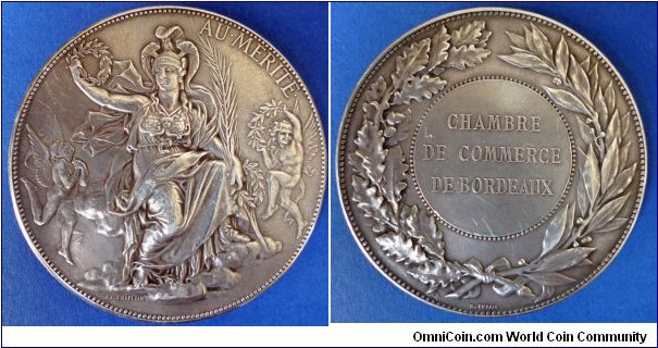 1800 o j France Chamber of Commerce of Bordeaux Medal by J.C. Chaplain/Henri Dubois strunked by Monnaie de Paris. Silver: 69MM./149 gms.
Obv: Depicting Athena Greek Goddess of War, Wisdom, Artisans, Artists and Masters School, awarded the Merit. Signed CHAPLAIN. Rev: Wreath surround with legend inner circle CHAMBRE DE COMMERCE DE BORDEAUX. Signed Henri DUBOIS.
