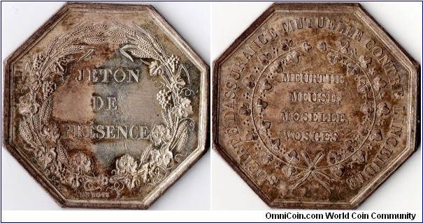 A scarcer silver `jeton de presence' issued for the Meurthe, Meuse, Moselle, Vosges Mutual Society which provided assurance coverage for fire risk. Little is known about this company which disappeared circa 1845-50. This jeton is undated and has no edge mark, which places it as having been minted at some point prior to 1832