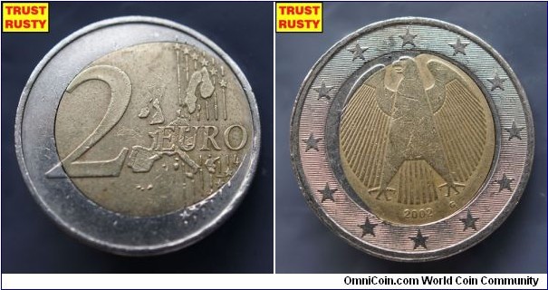 2 Euro center part flouting out