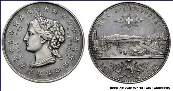 1885 Swiss Bern Eidgenossische Schutzenfest Medal by Eduard Durussel. Silver: 48MM./40.1 gms.
Obv: Head of Helvetia with hair band and Edelweiss wreath. Legend UEIL DIR HELVETIA with Stars surrounded. Rev: View of Bern county with Swiss Cross Star above. Legend EIDG SCHUTZENFEST, BERN 1885.
