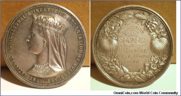 1895 Australia The National Agricultural & Industrial Association of Queensland Medal by J.S & A.B. Wyon. Silver: 50MM. 
Obv: Veiled & Crowned bust of Victoria to left. Legend THE NATIONAL AGRICULTURAL & INDUSTRIAL ASSOCIATION OF QUEENSLAND. Rev: Wreath of Agricult products & plants with awarded details engraved in centre EXHIBITION 1895 SPRY BROS HIVE OF ITALIAN BEES IN OBSERVATION HIVE. (Exhibition still take place in every August.)
