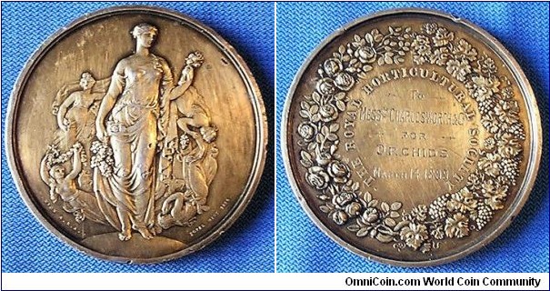 1899 UK Victoria Royal Horticultural Society Medal by Wyon A.R.A. Silver: 55MM./70.4 gms.
Obv: Flora, Greek Goddess of Nature, holding grapes & flowers surround by four angles. Signed W. WYON A.R.A. Rev: Legend THE ROYAL HORTICULTURAL SOCIETY with awarded details 'To Messers Charlewworth & Co. for Orchids March 14th 1899. Surround by wreath of  Roses, Grapes & Leaves.
