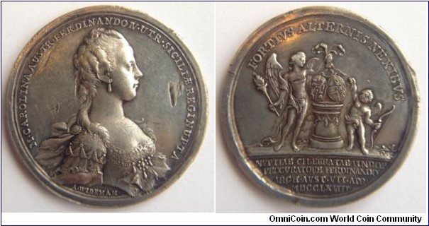 1768 Austria Habsburg Maria Theresia (1740-1780) on the wedding of her daughter Archuchess Maria Carolina with Ferdinand VI, King of Naples & Sicily on 7 August Medal by A. Wideman. Silver: 43MM./25.85 gms.
Obv: Bust of Archduchess to right in richly decorated dress. Legend M.CAROLINA AUSTR. FERDINANDIV.UTR.SICILIAE RHGINUPTA. Signed A. WIDEMAN. Rev: Hymen with a torch in her right hand. Cupid with bow in his left hand, holding the two escutcheons of Bourbon and Hapsbury. Lorraine on an altar. Legend FORTIVS ALTERNIS NEXIBVS. Exergue NVFTIAE CILEGRATAE VINDQ PROCVRATORE FERDINANDO ARCH.AVST.VII.APR.MDCCLXVIII.
