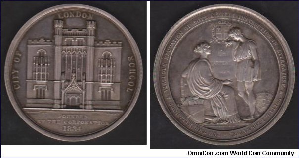 1834 UK Foundation of The City of London School Medal by B. Wyon. Silver 57MM./61 gms.
Obv: Façade of the school building. Legend CITY OF LONDON SCHOOL. Exergue FOUNDED BY THE CORPORATION 1834. Rev: Setaed figure of Knowledge instructs a youth. Legend FOR THE RELIGIOUS 7& VIRTUOUS EDUCATION OF BOYS & THEIR INSTRUCTION IN LITERATURE & USEFUL KNOWLEDGE.  (Number 4 from the City of London series of medals)
