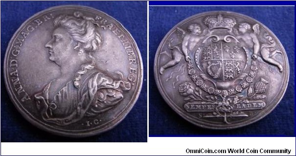 1707 UK Queen Anne Union Scotland & England Medal by J. Croker & S. Bull. Silver: 34MM.
Obv: Queen Anne Draped Bust left. Legend ANNA DG MAG BR FRA ET HIB REG. under trunc: I C. Rev: Arms of Britain upon escutcheon, supported on a platform inscribed SEMPER EADEM, and decorated with rose and thistle, two infant genii support a Crown  aboce the arm, collar and George on the Garter below.
