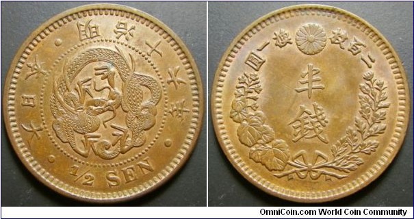 Japan 1883 1/2 sen. Nice condition except for a spot. Weight: 3.39g. 