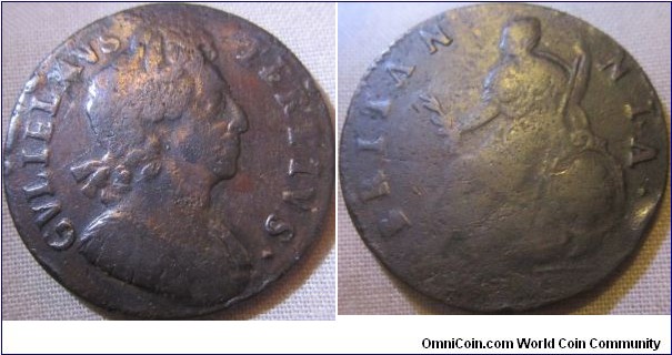 mid grade William III halfpenny, although no visible date, the Obverse and Britannia holding the olive branch on her knee was not used post 1700