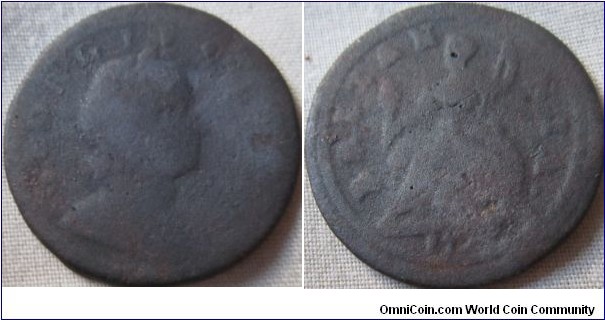 another erroded halfpenny this time from 1723, possibly a fake of the time.