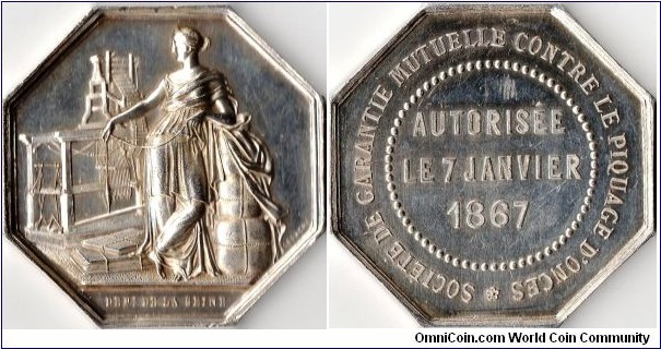 silver jeton struck for the Societe de Garantie Mutuelle Contre Le Piquage D'Onces, a society originally set up by the silk merchants and manufacturers of Lyon to counter the pilfering of silk.