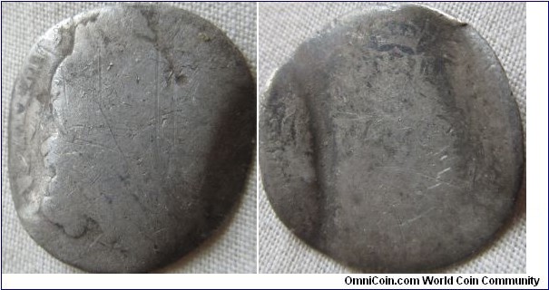 very worn william III sixpence turned into a love token, hard to tell date but looks like 1697
