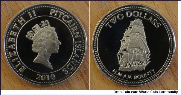 Pitcairn Islands | 
2 Dollars, 2010 | 
35 mm, 20.5 gr. | 
Aluminium-Bronze | 

Obverse: Queen Elizabeth II facing right, date below | 
Lettering: ELIABETH II PITCAIRN ISLANDS 2010 | 

Reverse: Bounty cannon, denomination above | 
Lettering: TWO DOLLARS H.M.A.V. BOUNTY |