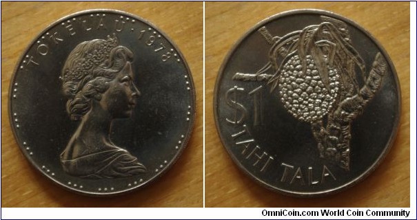Tokealu | 
1 Tala, 1978 | 
38.5 mm, 28.47 gr. | 
Copper-nickel | 

Obverse: Queen Elizabeth II facing right, date above | 
Lettering: TOKELAU • 1978 | 

Reverse: Coconut tree, denomination left | 
Lettering: $1 TAHI TALA |