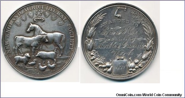 1881 UK New England Agricultural Society Medal. Silver: 48MM./43.9 gms.
Obv: Farm scene horse/cow/pig/sheep/duck & checken. Shield of 6 counties above with stars & wreath. Legend NEW ENGLAND AGRICULTURAL SOCIETY. Rev: Awarded in 1881 to Evans & Co., for Exhibit of Mrable & Granite Work. Wreath with agriculture products.

